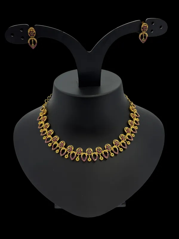Elegant_Gold-Plated_Ruby_and_Green_Stone_Necklace_Set_with_Heart-Shaped_Earrings