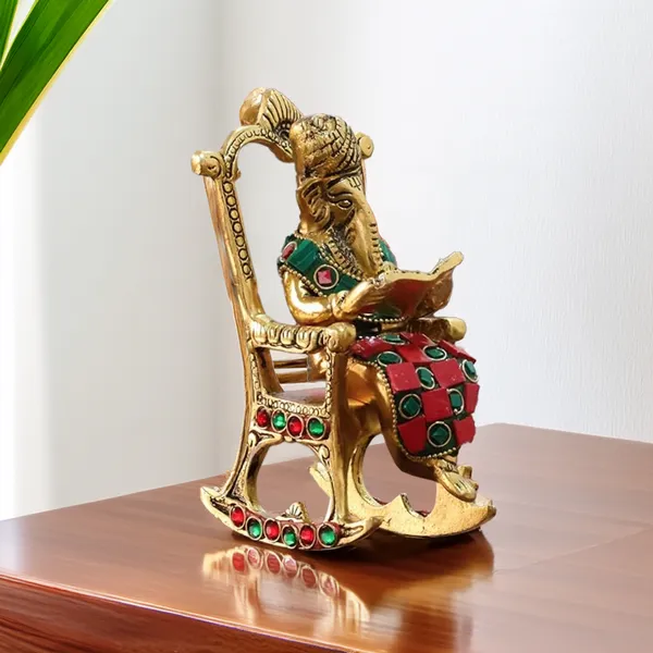 Hastcraft_Metal_Ganesha_Ji_Reading_Book_sitting_on_Chair_with_Handcrafted_Stone_Work_,_Table_Top_Elegant_Decor
