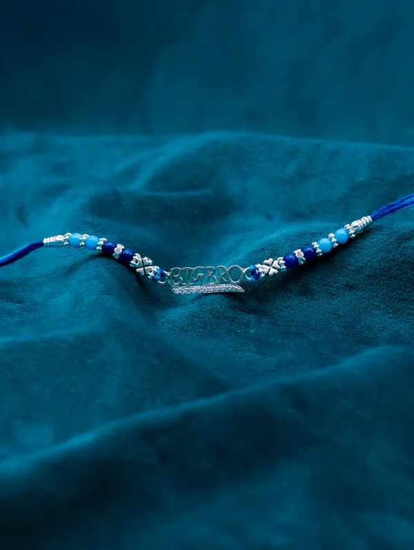925_Silver_Blue_Rakhi_With_Precious_White_Zircon_Stone_For_Women