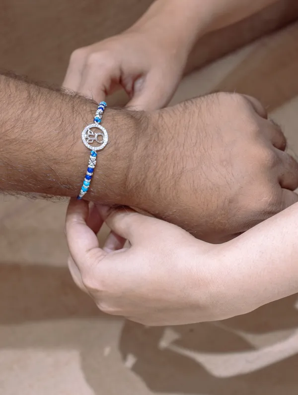 925_Silver_Blue_Rakhi_With_Precious_White_Zircon_Stone_For_Women