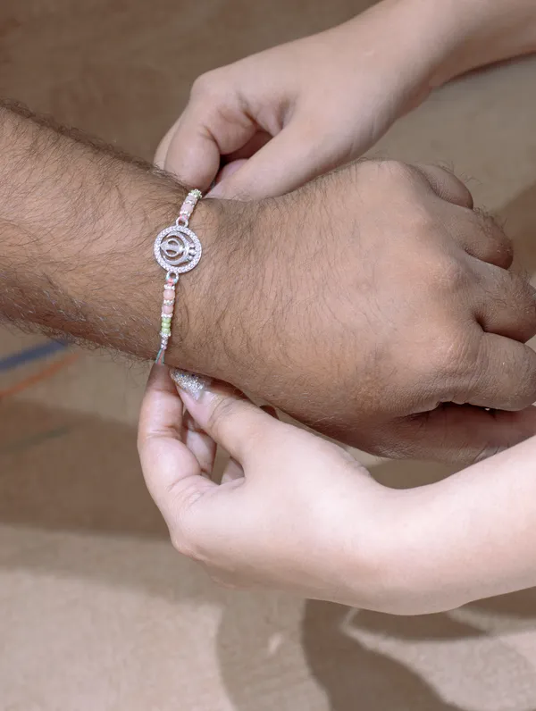 925_Silver_Rakhi_With_Precious_White_Zircon_Stone_For_Women