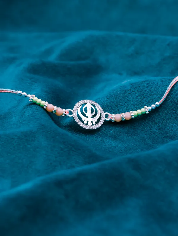 925_Silver_Rakhi_With_Precious_White_Zircon_Stone_For_Women