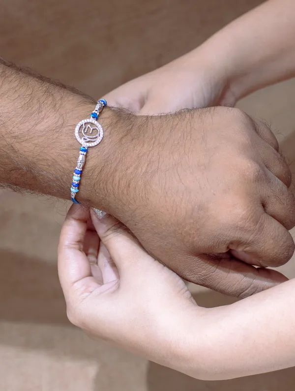 925_Silver_Blue_Rakhi_With_Precious_White_Zircon_Stone_For_Women