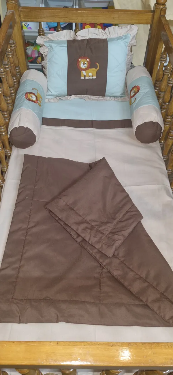 Blossoms_kids_bedding_set_with_1_bedsheet_(35"x50"),1_pillow_with_filler(12"x15")_,_2_bolsters_with_filler_(15"x15")_1_quilt_brown_colour(_35"x40")Ideal_for_upto_3_years)