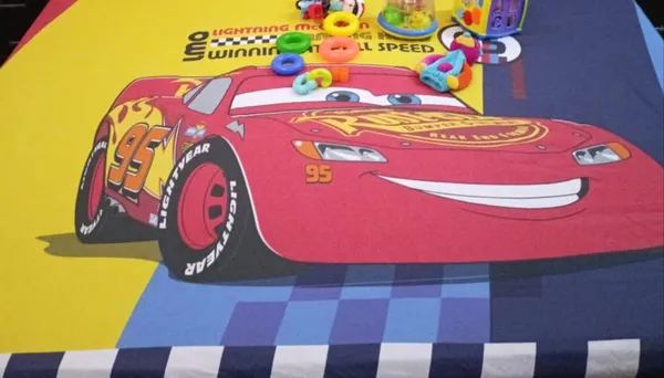 Blossoms_kids_Mcqueen_car_printed_double_bedsheet_._Premium_super_soft_and_durable_400_TC_fabric_with_2_engineered_pillows_,_100%_cotton._Very_safe_for_kids.