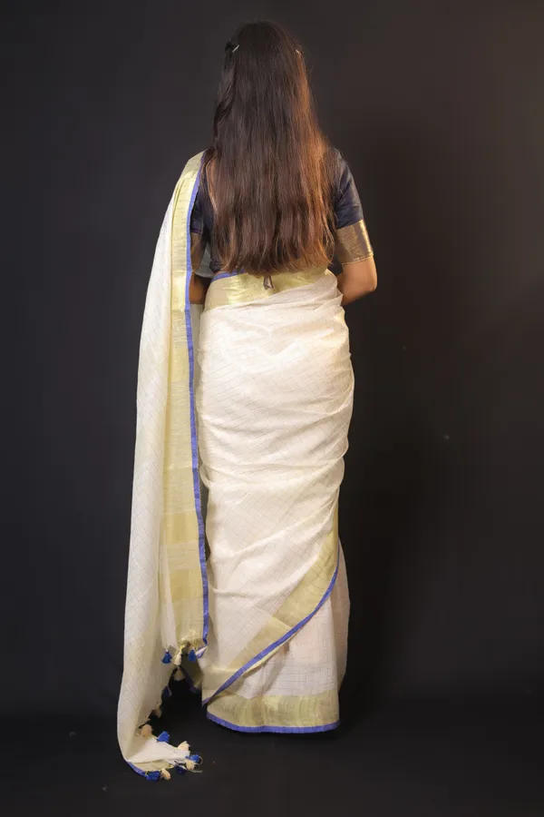 Off-White_Linen_Blend_Saree_with_Golden-Blue_Border_|_Handwoven_Bhagalpuri_Festive_Saree_–_Hatha_Karagha