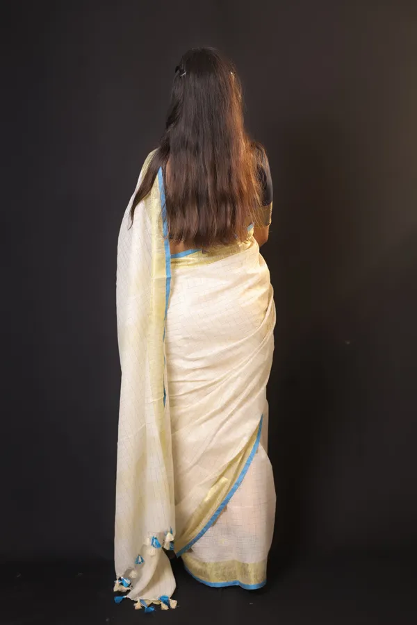 Off-White_Linen_Blend_Saree_with_Golden-Light_Blue_Border_|_Handwoven_Bhagalpuri_Festive_Saree_–_Hatha_Karagha