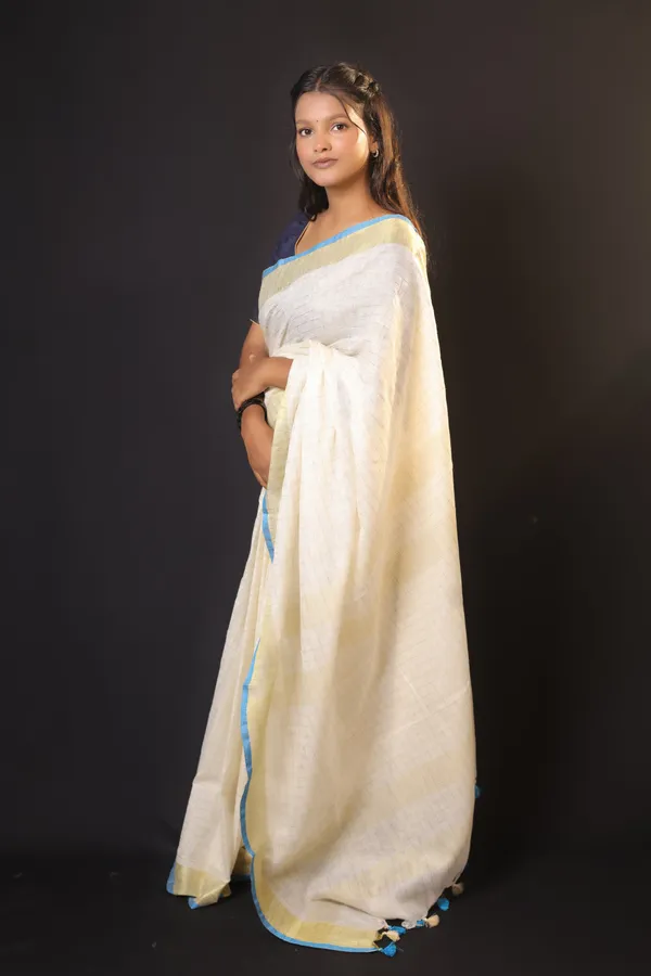 Off-White_Linen_Blend_Saree_with_Golden-Light_Blue_Border_|_Handwoven_Bhagalpuri_Festive_Saree_–_Hatha_Karagha
