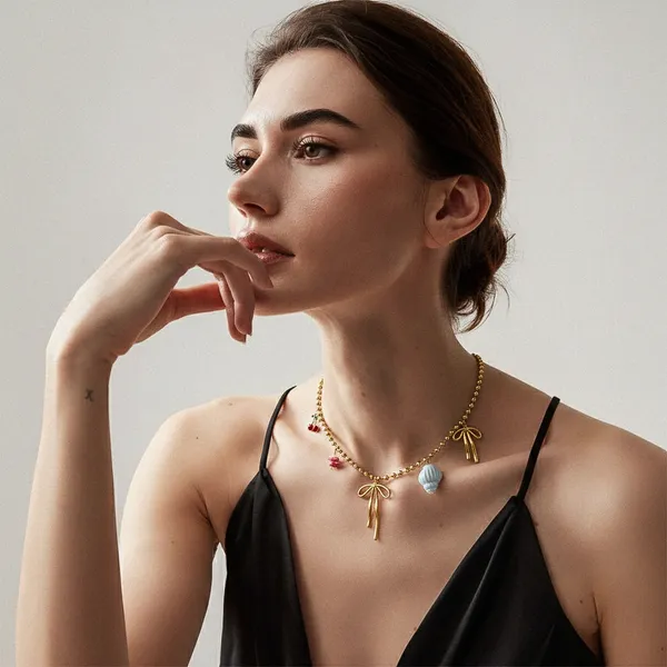 Sirena_Bow_Necklace_with_Charms_-_cherry,_shell,_varied_colours