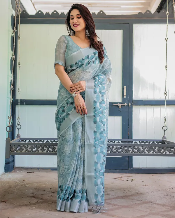 Light_Blue_Pure_Cotton_Linen_Saree_with_Geometric_and_Floral_Patterns_And_Tassels_With_Unstitched_Blouse