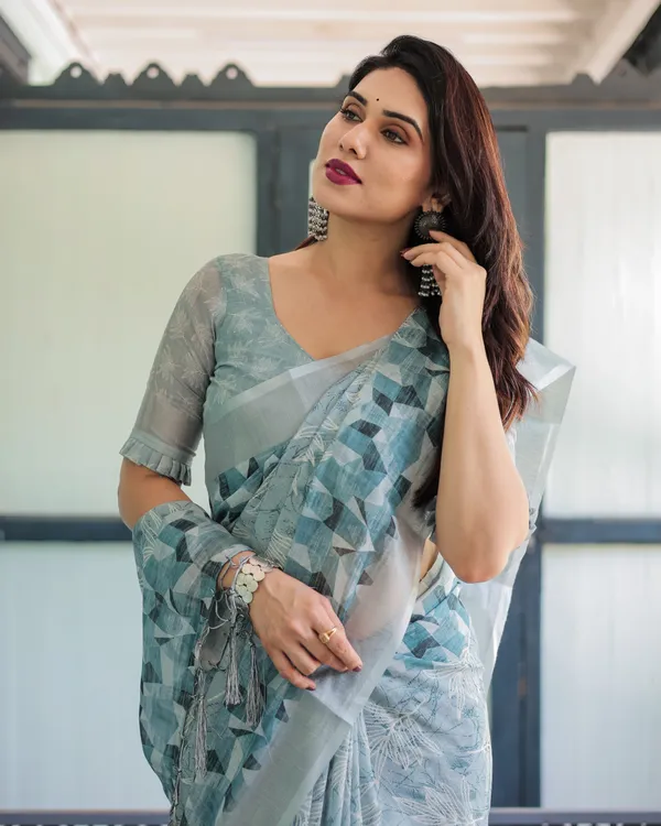 Light_Blue_Pure_Cotton_Linen_Saree_with_Geometric_and_Floral_Patterns_And_Tassels_With_Unstitched_Blouse