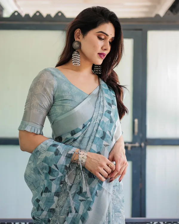 Light_Blue_Pure_Cotton_Linen_Saree_with_Geometric_and_Floral_Patterns_And_Tassels_With_Unstitched_Blouse