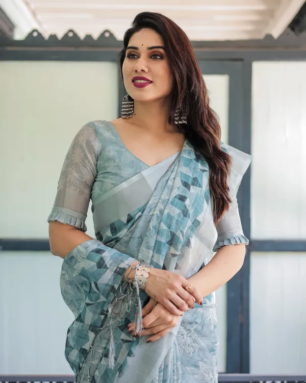 Light_Blue_Pure_Cotton_Linen_Saree_with_Geometric_and_Floral_Patterns_And_Tassels_With_Unstitched_Blouse