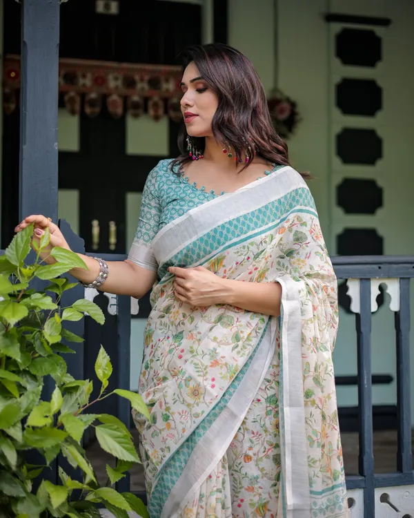Elegant_Floral_Printed_Pure_Cotton_Linen_Saree_in_Ivory_with_Teal_Border_and_,_Tassels_on_Edges_With_Unstitched_Blouse
