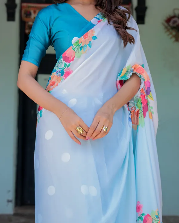 Sky_Blue_Satin_Georgette_Polka_Dot_Saree_with_Floral_Pallu_&_Teal__Handsfree_Draping_Loop_With_Unstitched_Blouse