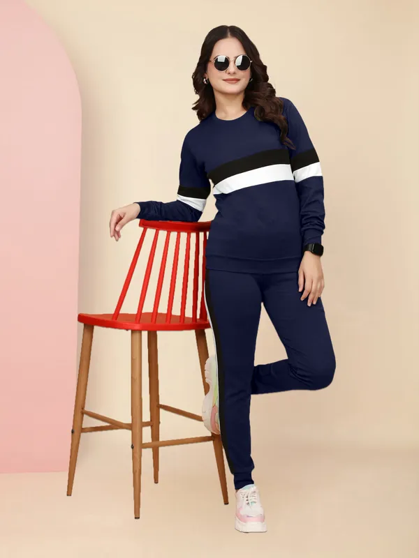 Women's_Navy_Blue_Athletic_Tracksuit_Set_with_Long_Sleeve_Sweatshirt_Featuring_Black_and_White_Horizontal_Stripes_and_Matching_Navy_Blue_Jogger_Pants_with_Black_Side_Stripes,_Perfect_for_Casual_Wear_and_Workouts