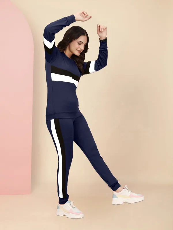 Women's_Navy_Blue_Athletic_Tracksuit_Set_with_Long_Sleeve_Sweatshirt_Featuring_Black_and_White_Horizontal_Stripes_and_Matching_Navy_Blue_Jogger_Pants_with_Black_Side_Stripes,_Perfect_for_Casual_Wear_and_Workouts