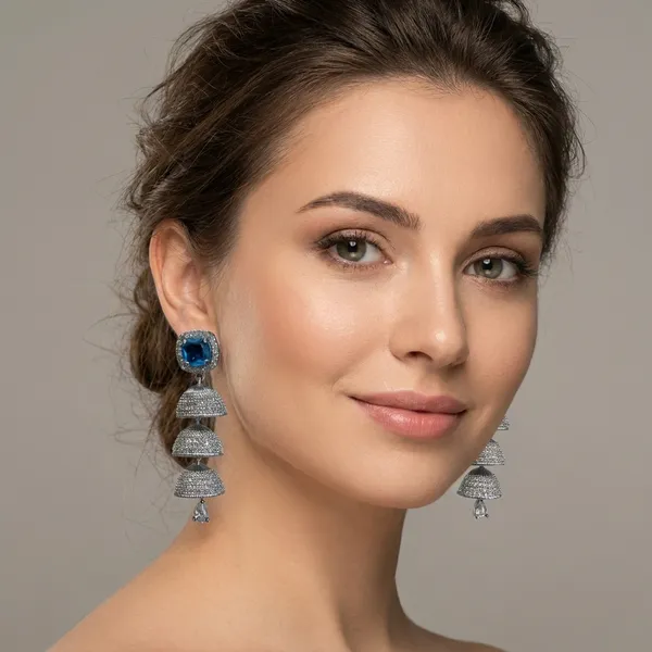 Elegant_Silver-Toned_Triple_Jhumka_Earrings_With_Blue_Stone_Studs