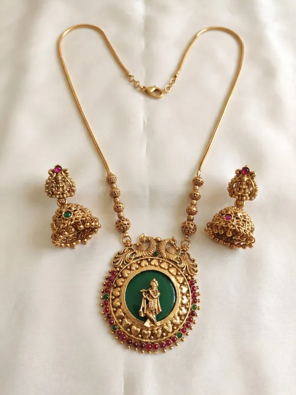 Antique_Gold_Plated_Krishna_Pendant_Chain_Set_with_Laxmi_Jhumka_Earrings_|_Green_Enamel_&_Ruby_Kundan_Jewelry