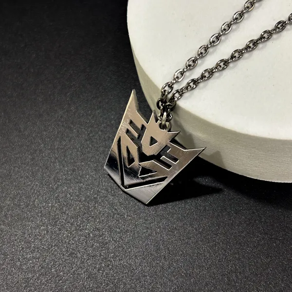 Steel_White_Decepticon_(Transformers)_Inspired_Metal_Pendant_(12_Inch)