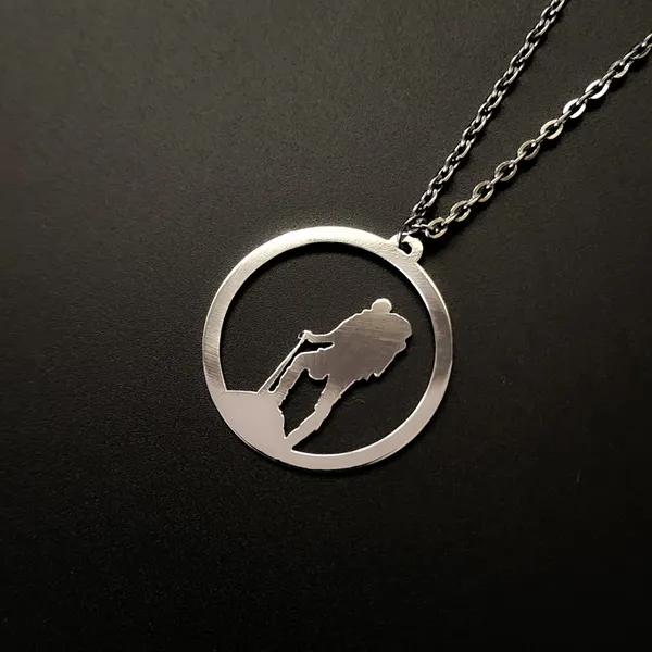 Steel_White_Adventure_Man_Metal_Pendant_(12_Inch)