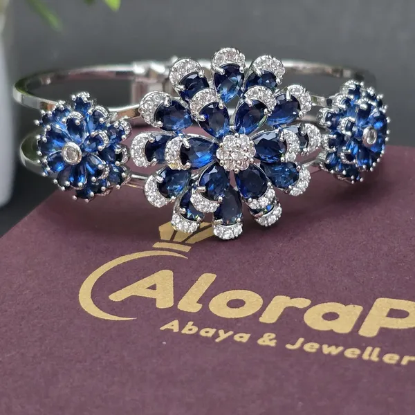 Blue_Stainless_Steel_Sapphire_With_American_Diamond_Flower_Design_Stone_Bangle