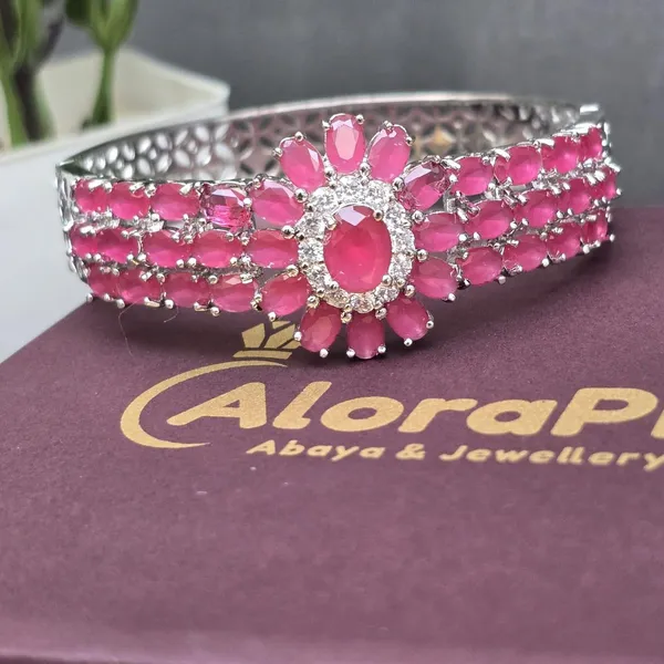 Pink_Stainless_Steel_Ruby_With_American_Diamond_Flower_Design_Stone_Bangle