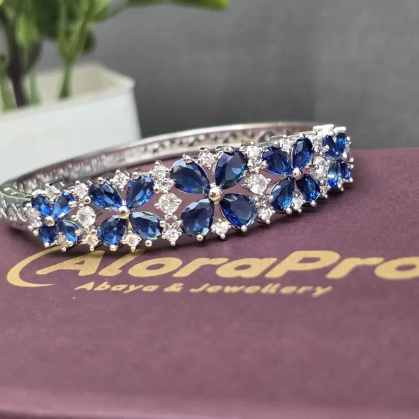 Blue_Stainless_Steel_Sapphire_With_American_Diamond_4_Leaf_Flower_Design_Stone_Bangle