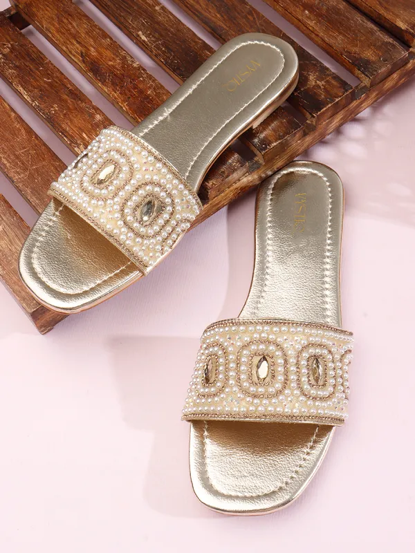 These_flat_slide_sandals_feature_a_metallic_bronze_finish_on_the_footbed_and_sole