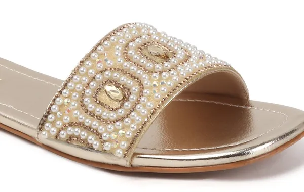These_flat_slide_sandals_feature_a_metallic_bronze_finish_on_the_footbed_and_sole
