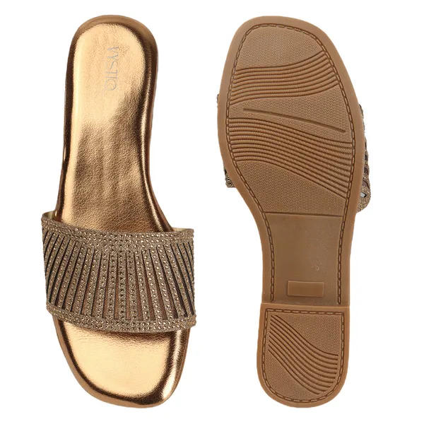 Elegant_slip-on_sandals_with_pearl-studded,_soft_padded_insole,_and_large_decorative_front.