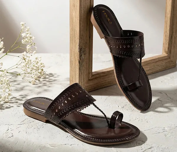 A_pair_of_stylish_women�s_slip-on_loafers_in_a_warm_tan/brown_color_with_a_subtle_ribbed_texture.