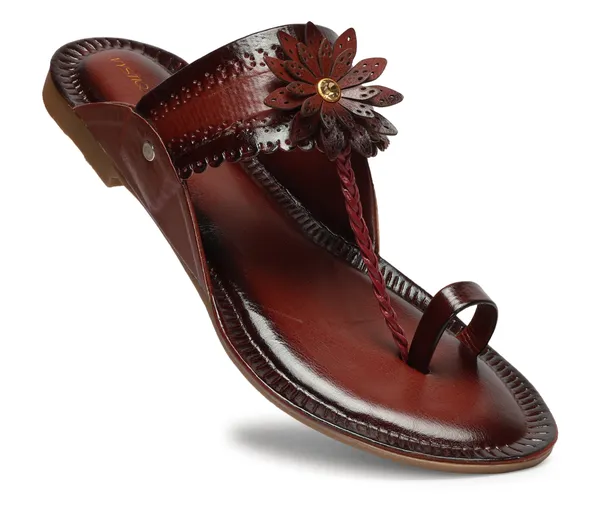 A_pair_of_stylish_women�s_slip-on_loafers_in_a_warm_tan/brown_color_with_a_subtle_ribbed_texture.