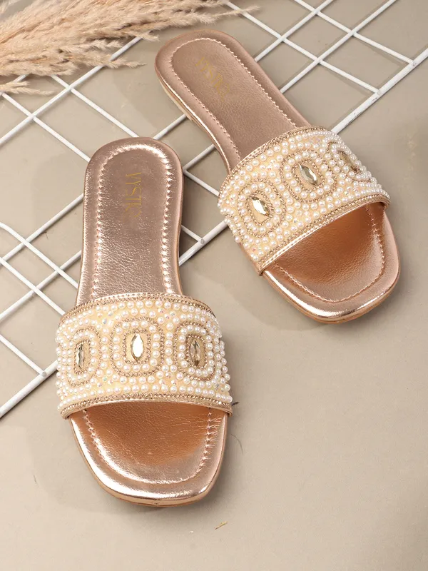 These_flat_slide_sandals_feature_a_metallic_bronze_finish_on_the_footbed_and_sole