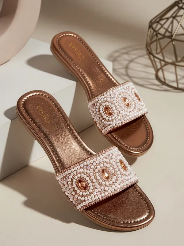 These_flat_slide_sandals_feature_a_metallic_bronze_finish_on_the_footbed_and_sole
