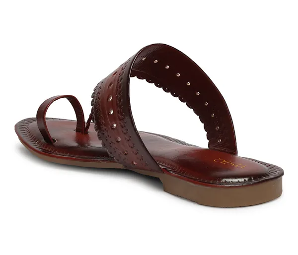 A_pair_of_stylish_women�s_slip-on_loafers_in_a_warm_tan/brown_color_with_a_subtle_ribbed_texture.