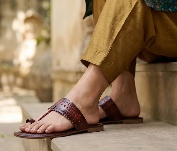 A_pair_of_stylish_women�s_slip-on_loafers_in_a_warm_tan/brown_color_with_a_subtle_ribbed_texture.