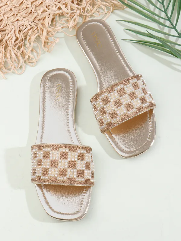 These_flat_slide_sandals_feature_a_metallic_bronze_finish_on_the_footbed_and_sole