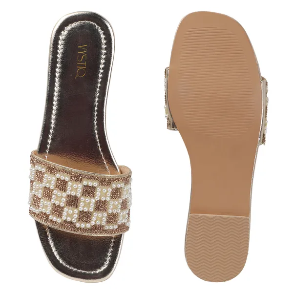 These_flat_slide_sandals_feature_a_metallic_bronze_finish_on_the_footbed_and_sole