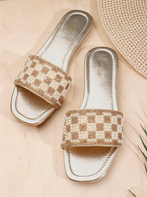 These_flat_slide_sandals_feature_a_metallic_bronze_finish_on_the_footbed_and_sole