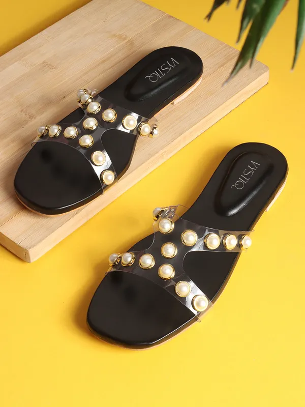 Elegant_slip-on_sandals_with_pearl-studded_V-strap,_soft_padded_insole,_and_large_decorative_front.