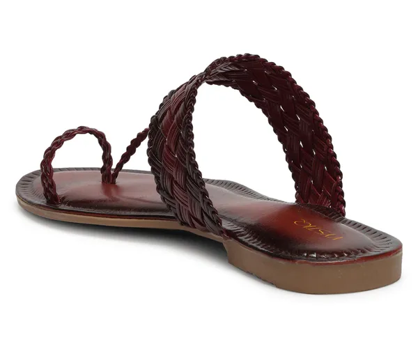 A_pair_of_stylish_women�s_slip-on_loafers_in_a_warm_tan/brown_color_with_a_subtle_ribbed_texture.