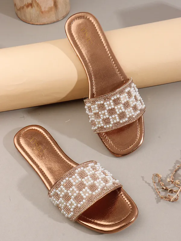 These_flat_slide_sandals_feature_a_metallic_bronze_finish_on_the_footbed_and_sole