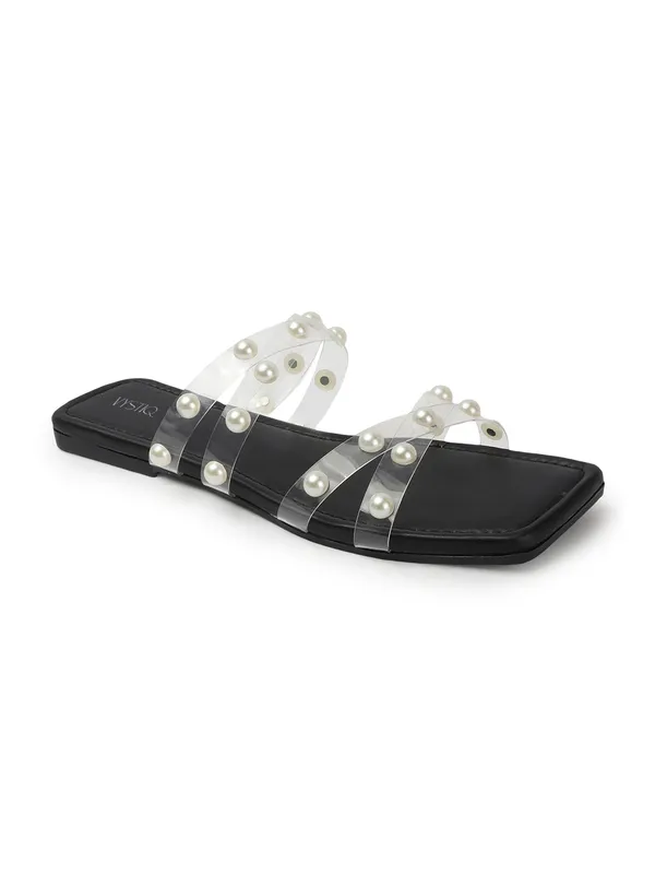Elegant_slip-on_sandals_with_pearl-studded,_soft_padded_insole,_and_large_decorative_front.