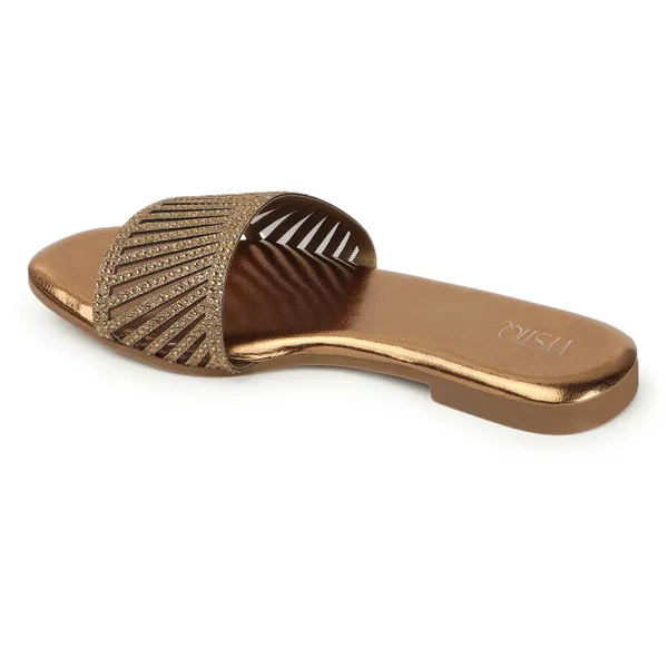 Elegant_slip-on_sandals_with_pearl-studded,_soft_padded_insole,_and_large_decorative_front.