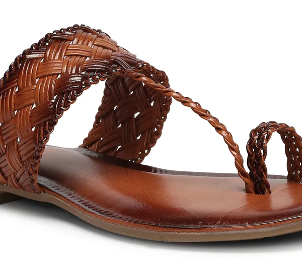 A_pair_of_stylish_women�s_slip-on_loafers_in_a_warm_tan/brown_color_with_a_subtle_ribbed_texture.