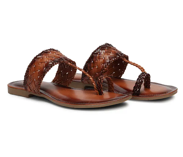 A_pair_of_stylish_women�s_slip-on_loafers_in_a_warm_tan/brown_color_with_a_subtle_ribbed_texture.