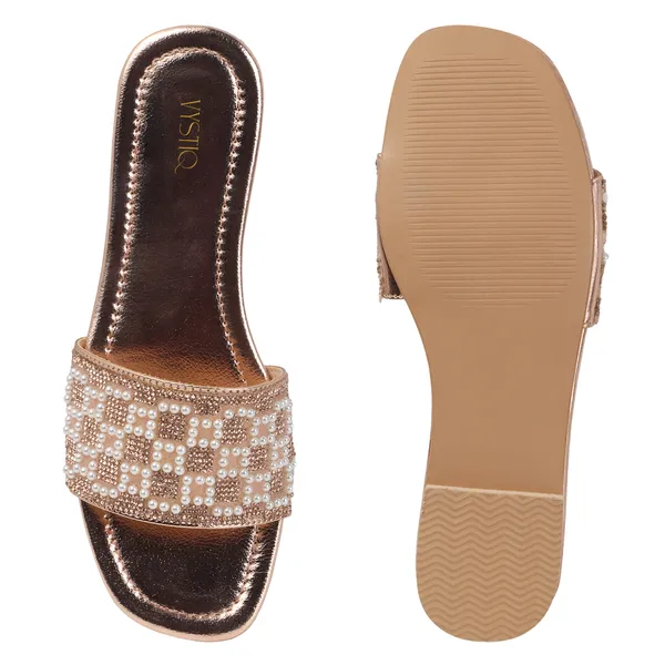 These_flat_slide_sandals_feature_a_metallic_bronze_finish_on_the_footbed_and_sole