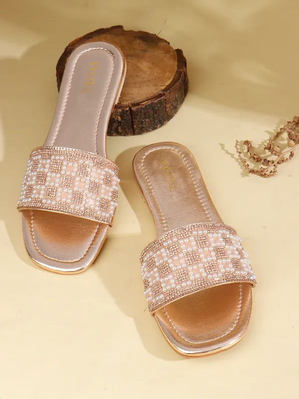 These_flat_slide_sandals_feature_a_metallic_bronze_finish_on_the_footbed_and_sole