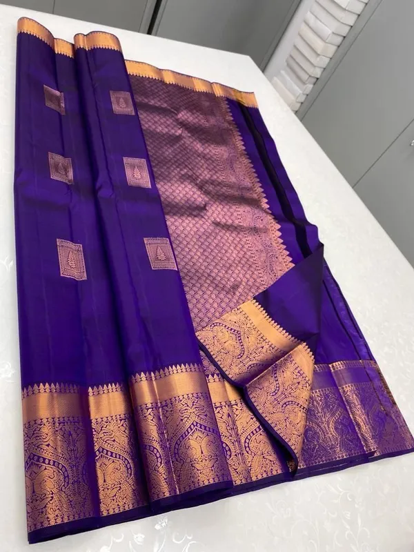 Blue_Kanjivaram_Silk_Saree_with_Copper_Zari_Peacock_Motifs_and_Temple_Border